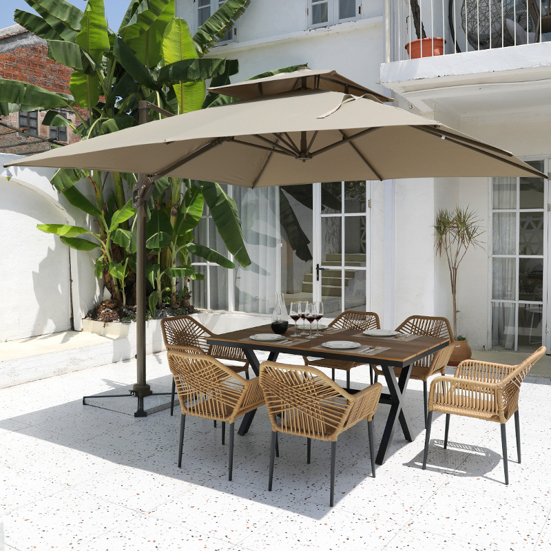 Mesa y sillas de ratán tejida de patio al aire libre